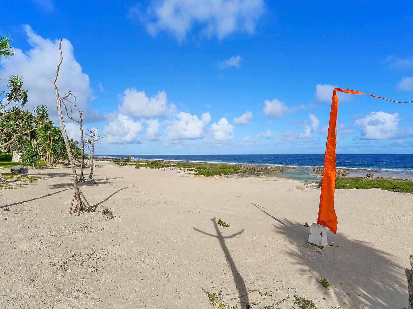Idyllic sand beach beside the villa and pool